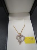 A hallmarked 9ct gold diamond set heart pendant on chain, approx. combined weight 3.3g