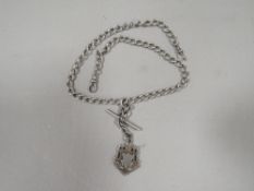 An antique silver gents pocket watch double Albert chain