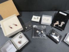 Nine pairs of silver earrings