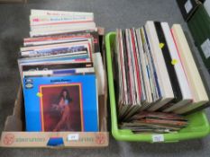 Two trays of assorted LP records with a small selection of singles