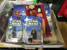 A selection of boxed Star Wars figures and a single packed Superman figure