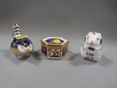 Three pieces of Royal Crown Derby consisting of two paperweights and a trinket