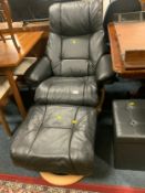 A modern black recliner chair and footstool