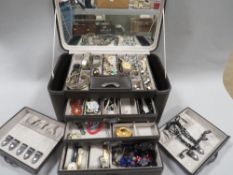 A travelling jewellery box and contents to include watches, costume jewellery etc
