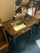 A vintage walnut case Singer electric sewing machine to include a reproduction half-moon table