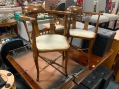 A pair of Edwardian inlaid armchairs