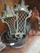 Two cast decorative wall sconces, a carved wooden corbel / shelf, plus a coal bucket