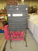 A vintage wrought iron display stand