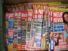 Three boxes of adult magazines