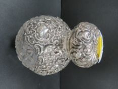 A large silver mounted cut glass scent bottle