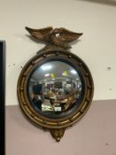 A antique style gilt wall mirror with eagle surmount H 68 cm