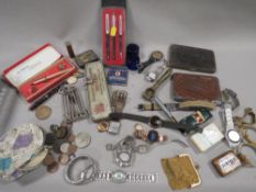 A box of watches, pens and collectables