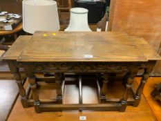 An oak carved nest of tables