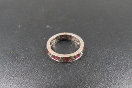 A gemset eternity ring stamped 9ct, approx. weight 3.3g