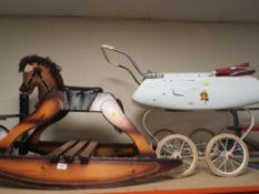 A vintage rocking horse and vintage pram
