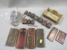 A tray of collectables to include printing blocks, coins etc