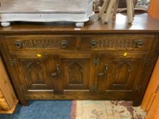 An oak reproduction sideboard