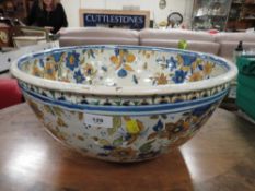 A large Continental Faience style pottery bowl approx Dia. 47cm, A/F