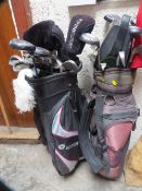 Two sets of golf clubs including bags