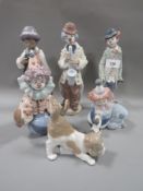 Six Lladro figures to include a boy and his clarinet