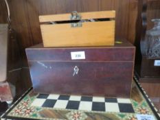 A vintage tea caddy together with a modern chess board and pieces