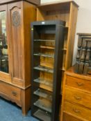 A modern honey pine open bookcase together with another modern bookcase