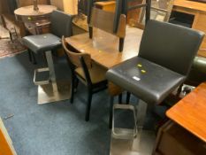 A pair of modern black swivel barstools