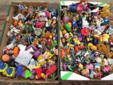 Two trays of assorted vintage McDonalds happy meal toys and other similar examples