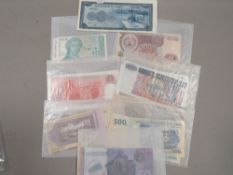 Forty plus uncirculated world banknotes