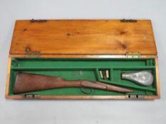 A vintage gun case containing gun stock etc.