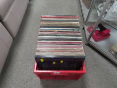A vintage angle poise lamp together with a tray of assorted LP records