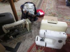 A Toyota differential over locker together with two vintage sewing machines to include Necchi