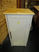 A small modern cabinet with two modern rugs