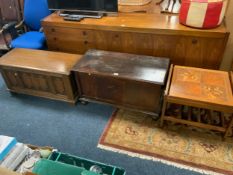 A reproduction oak linen fold blanket box together with another vintage blanket box and a mid-