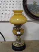 A vintage yellow glass oil lamp