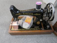 A cased vintage singer sewing machine