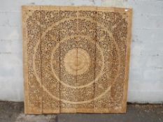 A very large hand carved Balinese hardwood decorative fretwork panel in six rectangular pieces,