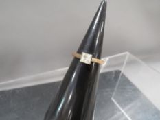 An unmarked yellow metal dress ring approx. weight 2.5g