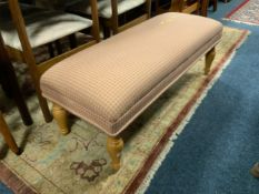 A modern upholstered long stool L 106 cm