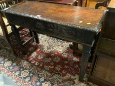 An antique oak carved hall console table with single drawer W 107 cm