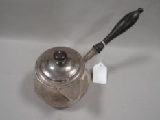 A Georgian hallmarked silver brandy pan and cover by Robert Hennell