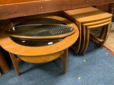 A mid-century teak circular glass top table together with a mid-century mirror and nest of tables