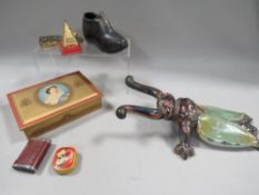 A tray of collectables to include a Golden Pyramid, radiogram needle tin etc