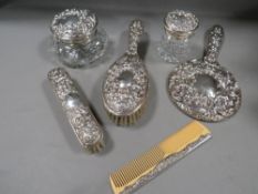 A six piece hallmarked silver dressing table set
