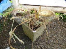 Three concrete garden planters