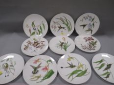 A quantity of decorative plates signed to the reverse and dated 1879- mostly painted with tropical