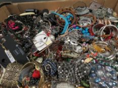 A large tray containing costume jewellery