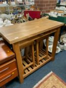 A modern breakfast table with drawer and two stools