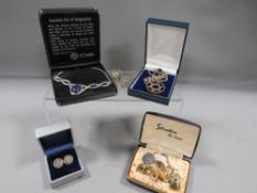 A boxed pair of silver Celtic design earrings, a boxed silver necklace, along with other jewellery