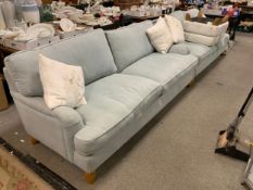 Two large Ercol upholstered sofas together with an Ercol storage stool in different fabric